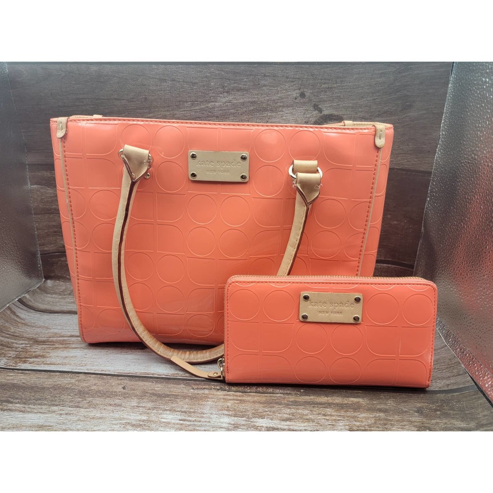 Orange Kate Spade shoulder bag and matching wallet